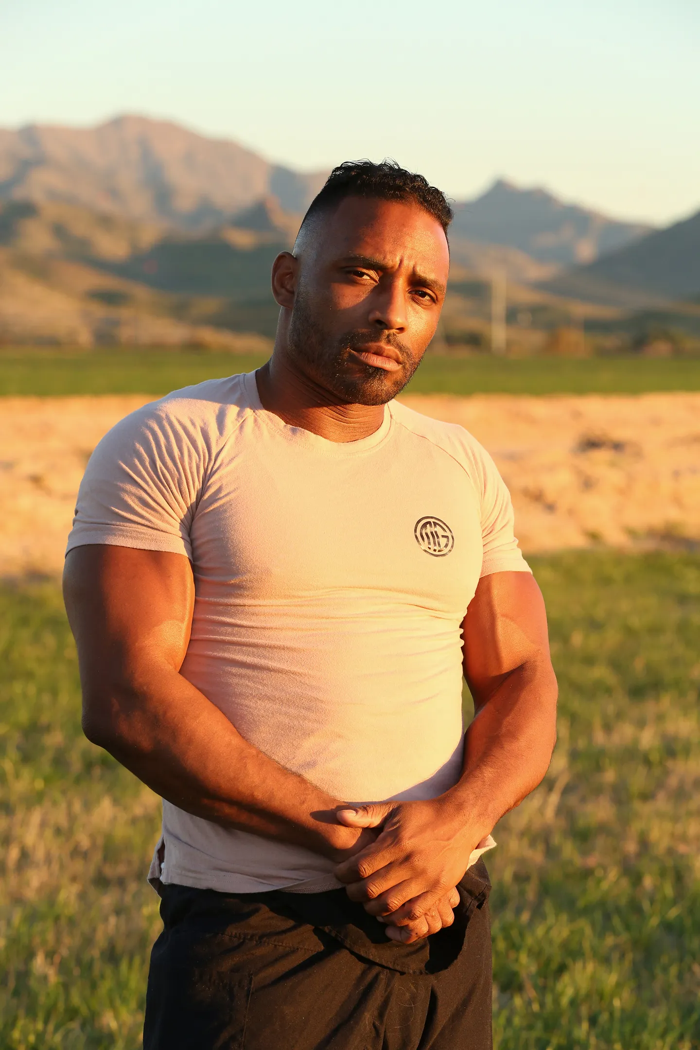 Demaris Parker standing in the Arizona desert at golden hour